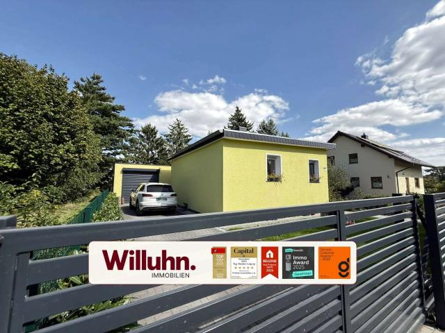 Hochwertig saniert: Einfamilienhaus mit flexibel nutzbarem Nebengebäude und idyllischem Koiteich