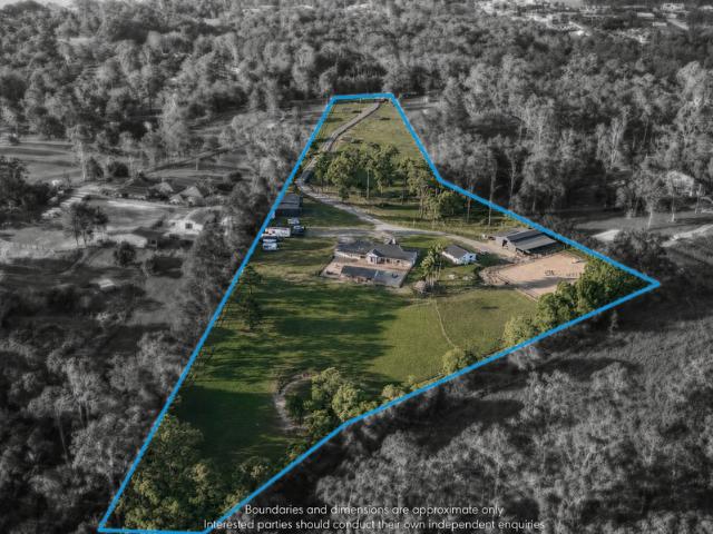 Horse Ready Acreage with Dual Living and Equestrian Facilities