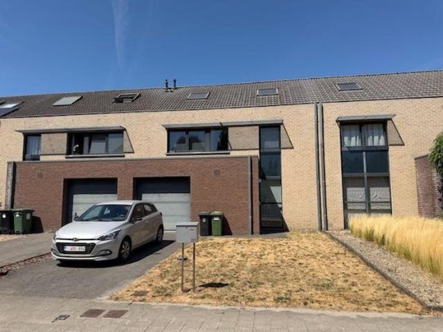 House with an attached garage and a yard