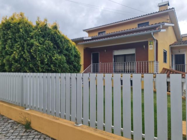 House with garden in village