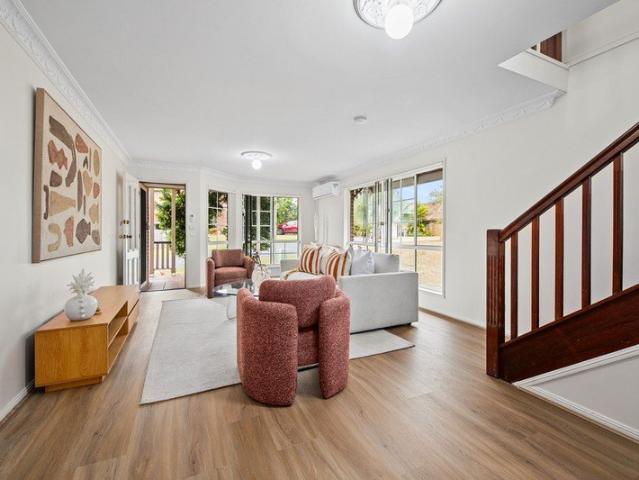 House Sized Four Bedroom Townhome with Two Living Areas & Large Backyard
