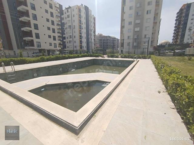 HRK'DEN ERDEMLİ AKDENİZ MAH'DE 1+1 HAVUZLU SATILIK DAİRE