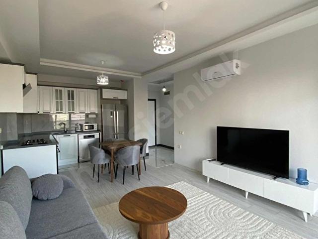 HRK'DEN TÖMÜK SAHİL'DE FULL EŞYALI 1+1 KİRALIK HAVUZLU DAİRE