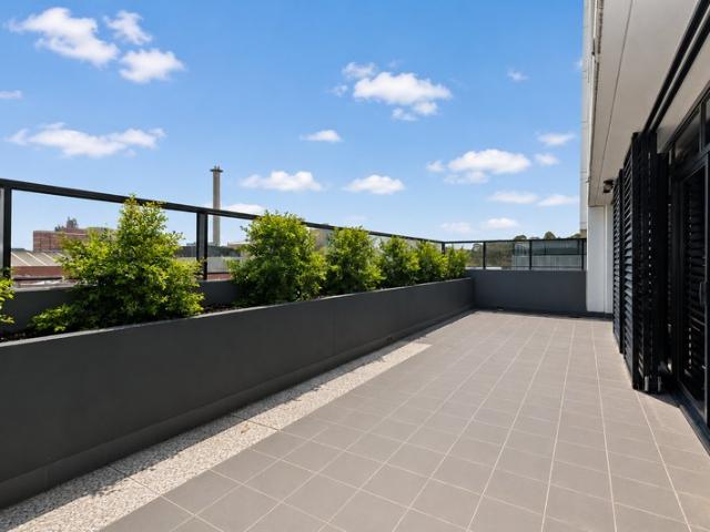 Huge balcony terrace is an entertainer's dream with city glimpses
