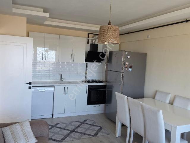 İncek Mahallesi'nde Satılık Eşyalı 1+1 Bakımlı Daire