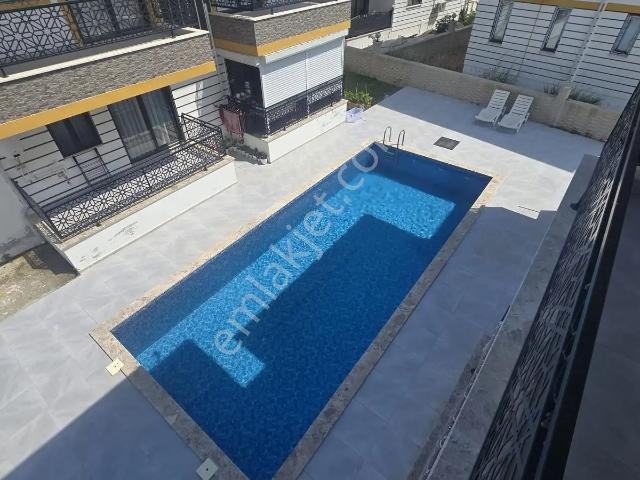Çiğdem Emalk'tan Ortaca'da Satılık Havuzlu Eşyalı Daire