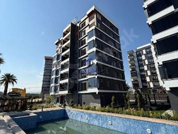 ICON'DAN HAVUZLU SİTE İÇERSİNDE GENİŞ OTURUMLU 1+1
