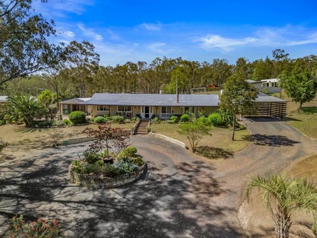 Idyllic Acreage Living Meets Classic Country Charm!