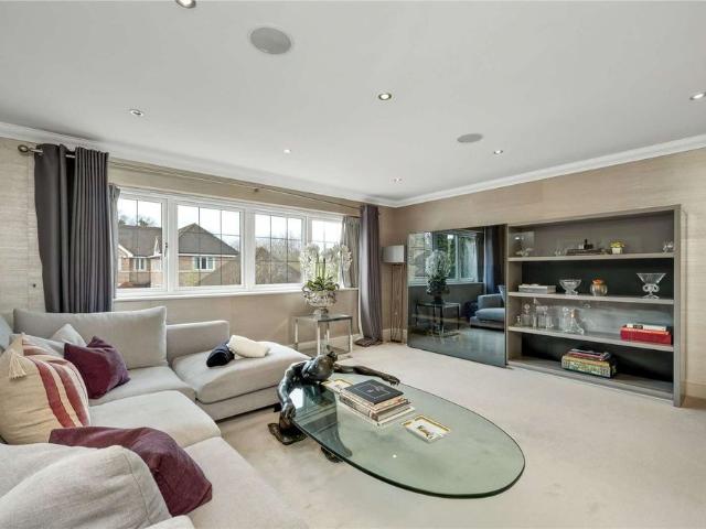 Idyllic family home situated within a private gated development in the heart of Esher with stunning views of Sandown Park