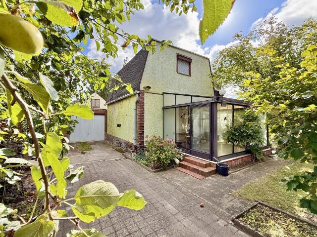 Einfamilienhaus mit Wintergarten und Teilunterkellert