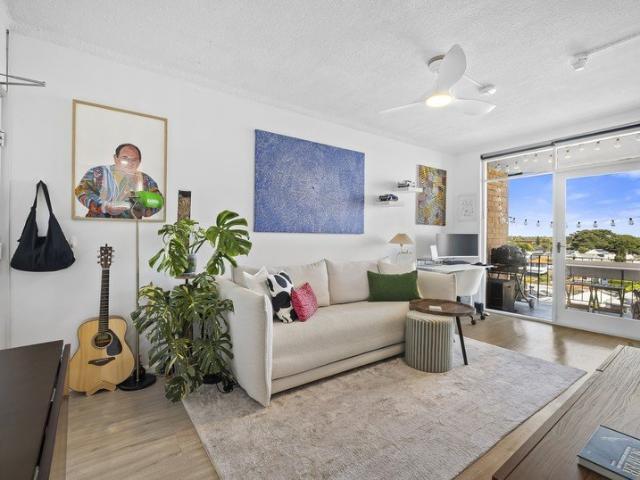 Immaculate apartment with parking and district views