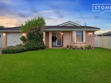 Immaculate brick home with pool, workshop and multiple living areas