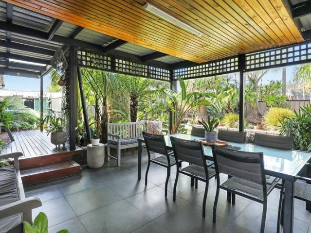 Immaculate Coastal Living with Lush Garden Surrounds