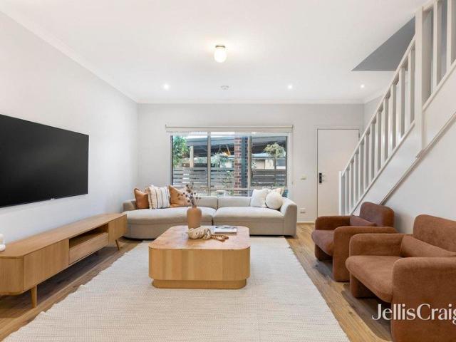 Immaculate contemporary townhouse with rare versatility
