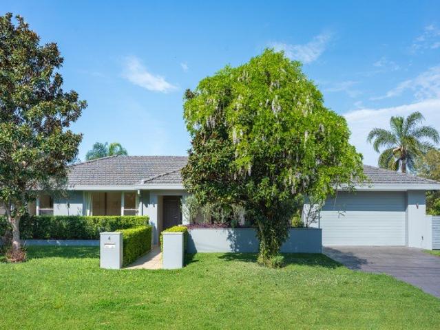 Immaculate full brick single level home, high ceilings throughout, private landscaped gardens