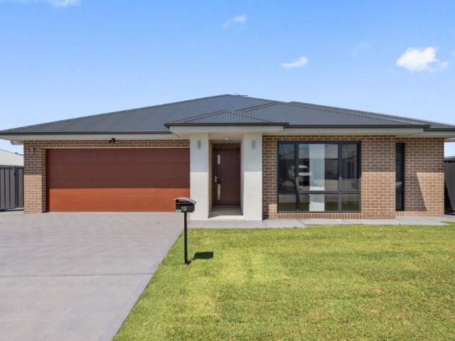 Contemporary home with lawn maintenance included