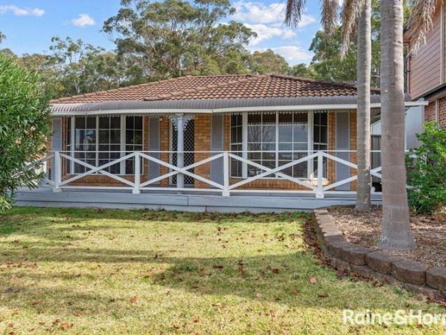 Family Living with Rare Side Access on a Generous Level Block