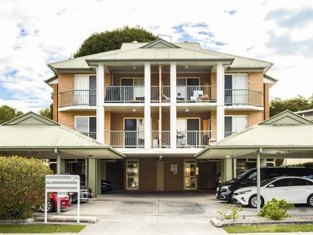 Immaculate First Floor Apartment in a Conveniently Located Boutique Complex