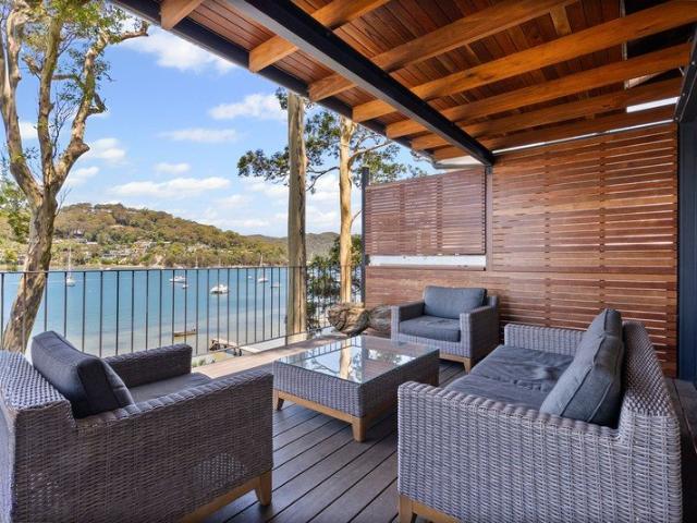 Immaculate Pittwater Retreat with Panoramic Water Views & Shared Jetty