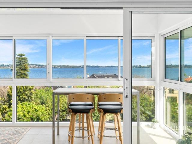 IMMACULATE RIVERSIDE LIVING WITH PANORAMIC RIVER VIEWS