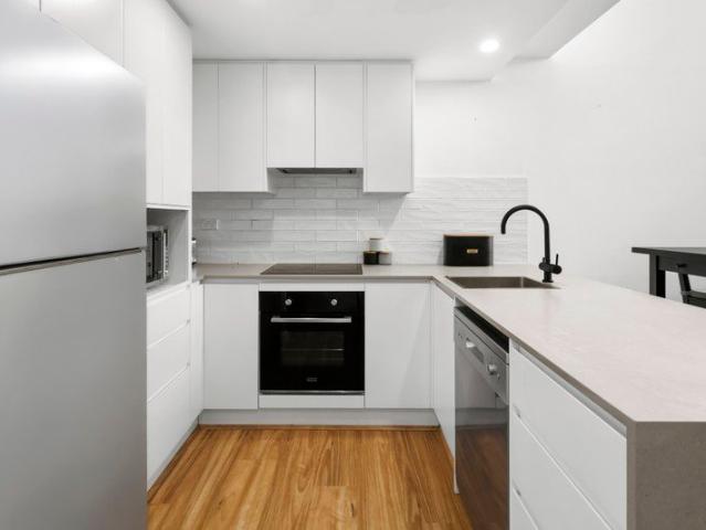 Immaculate split level courtyard apartment in a convenient Dee Why location