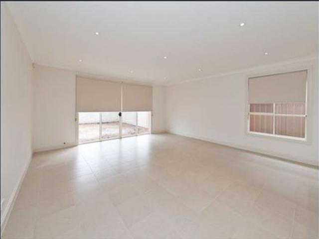 IMMACULATE THREE BEDROOM FULLY AIR CONDITIONED DOUBLE STOREY TOWNHOME RESIDENCE OFFERING THREE LIVING AREAS WITH ABSOLUTE LIFESTYLE