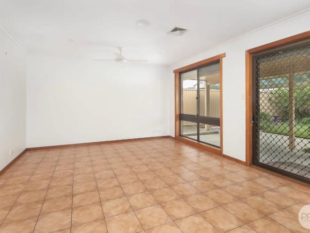 IMMACULATELY KEPT FAMILY HOME WITH SEPARATE STUDY, SECURITY SHUTTERS, SOLAR, CATIO & SHEDDING!
