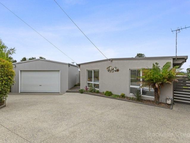 IMMACULATELY PRESENTED HOME WITH BAY VIEW AND EXPANSIVE GARAGE!