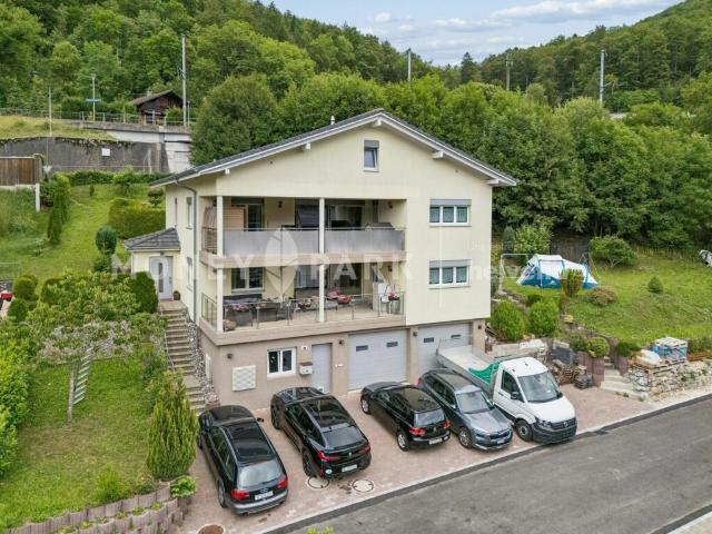 Immeuble de 2 appartements de 4.5 pièces offrant de nombreuses possibilités d'aménagement et de développement
