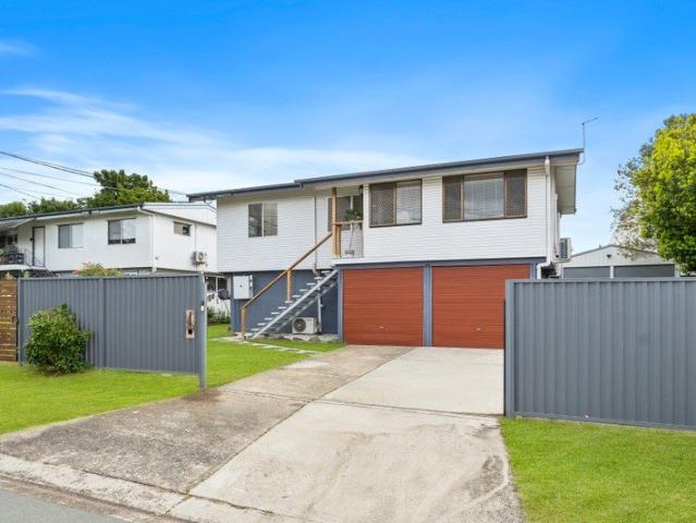 IMPECCABLY PRESENTED HIGH SET FAMILY HOME WITH SIDE ACCESS, UNDERCOVER REAR DECK & LARGE 6X6M PLUMBED/POWERED SHED!