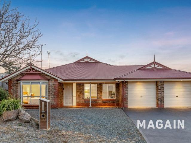 Impressive Estate Living with a large rear yard boasting Wetland & Sea Views