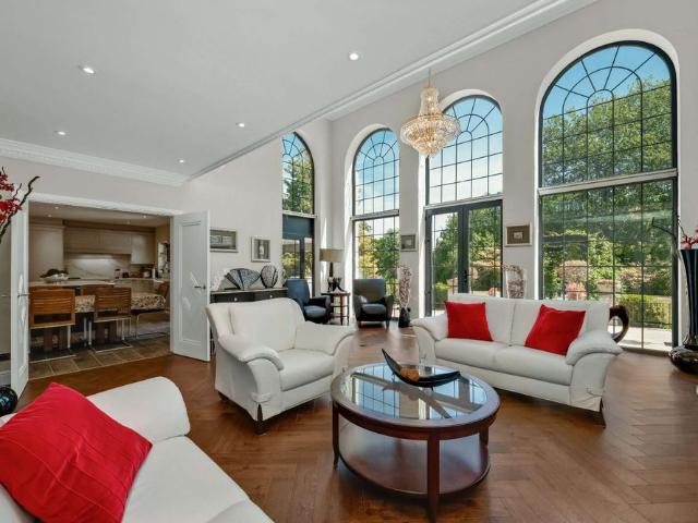 Impressive gated residence on the world renowned St George's Hill estate, offering luxurious living accommodation alongside a private leisure complex with indoor pool, sauna and steam room