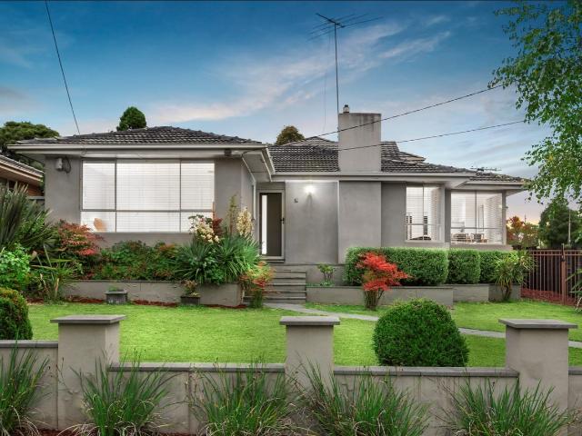 Impressive Home on Inviting Corner Garden