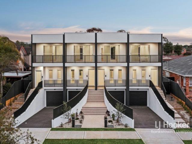 Impressive Three Level Residence with Tandem Basement Garage, Multiple Living Areas & Versatile Family Living