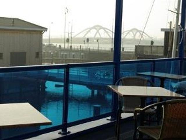 In Amsterdam on the waterfront a part of a fully furnished modern under architecture built studio in a watervilla to let
