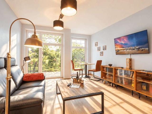 In Laufnähe zur Ostsee: Neuwertige Ferienwohnung mit Gartenflair