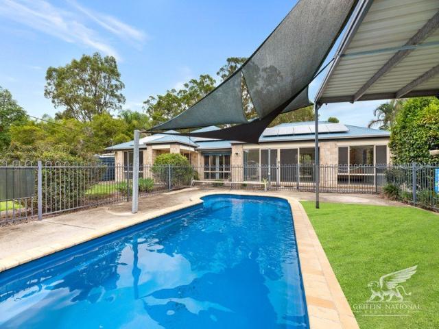 Incredible 5 Bedroom Home! Pool! Shed! Land! Multiple Living Areas!