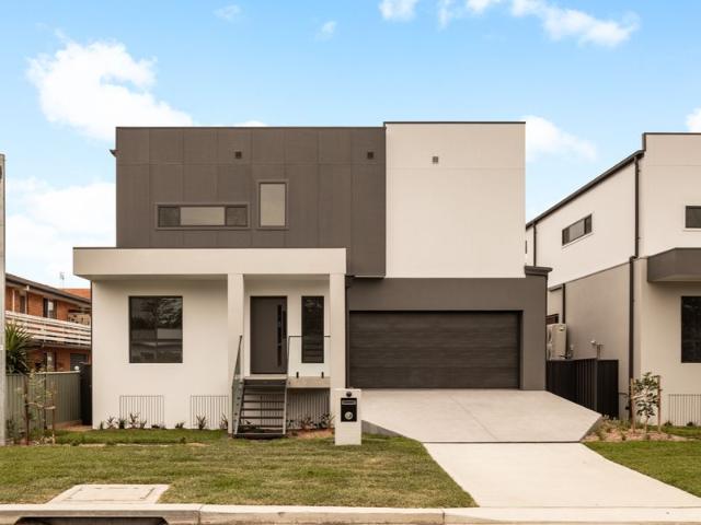 INDULGE IN COASTAL LUXURY LIVING WITH VIEWS OF THE BAY