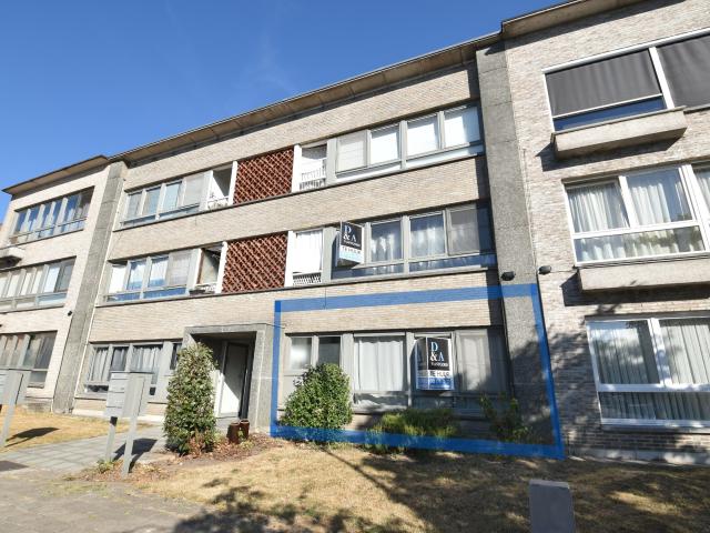 Instapklaar gelijkvloers appartement met bureauruimte, gemeenschappelijke tuin en uitstekende ligging in Temse