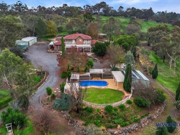 Instructed by the Mortgagee. 1.5 hectares of grand family living with elevated country views and privacy