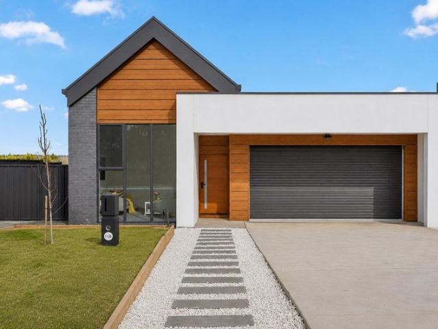Inspired Edge of Village Living Brand New Chalet Style Home