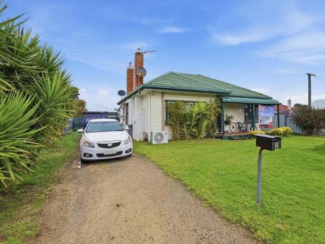 INVEST OR NEST: SPACIOUS HOME ON A SUNNY CORNER BLOCK