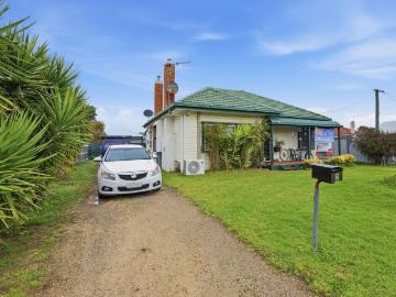 INVEST OR NEST: SPACIOUS HOME ON A SUNNY CORNER BLOCK