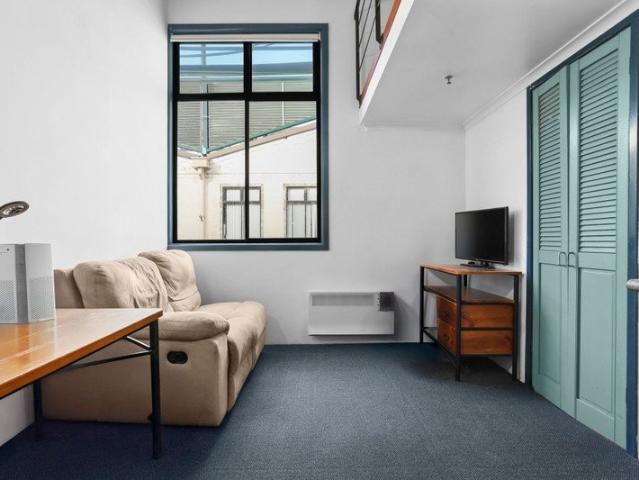 Investment Opportunity Loft Style Studio with Courtyard Views