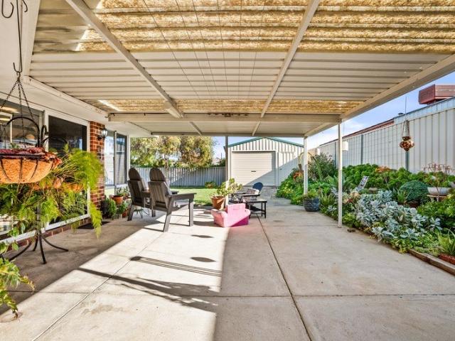 INVITING FAMILY HOME WITH WELL MAINTAINED GARDENS, GATED DRIVE THROUGH ACCESS AND A POWERED WORKSHOP WITHIN