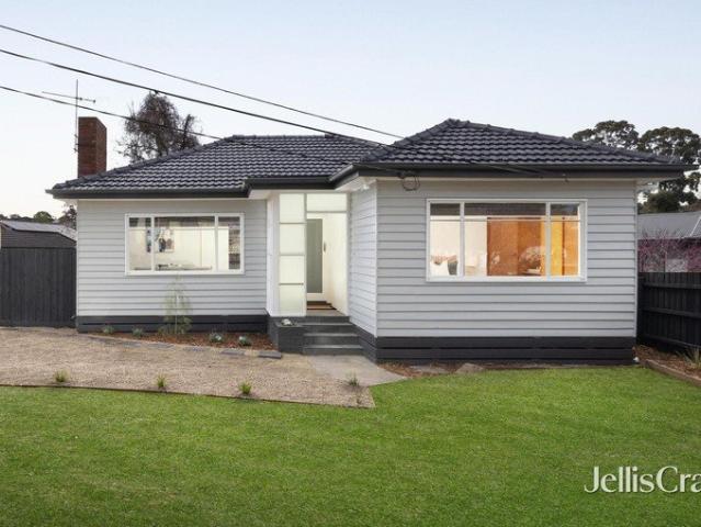 Inviting single level family home with expansive north facing backyard