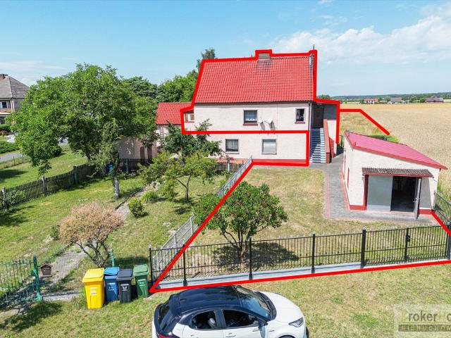 Urokliwy dom z działką 1700 m², garaż, własne C.O