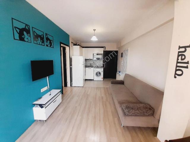 Kaan Emlak'tan Asmalıevler'de Ara Kat Balkonlu 1+1 Eşyalı Apart