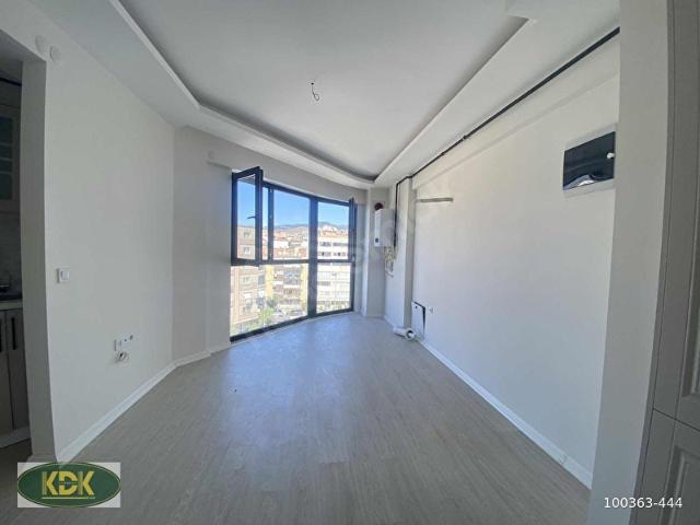 KARŞIYAKA'DA MERKEZİ KONUMDA SIFIR SATILIK 1+1 DAİRE