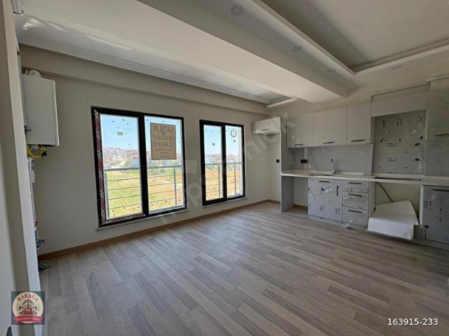 KARACA'DAN ORTACAMİ MAHALLESİNDE 2+1 DENİZ GÖREN SIFIR DAİRE